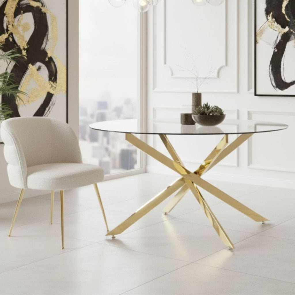 Modern dining room with a glass table and gold legs, Cream chair