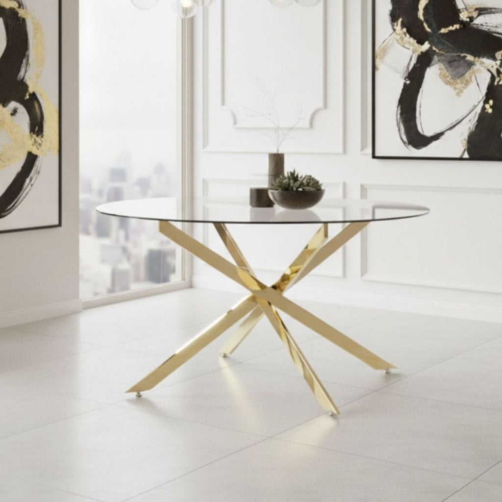 Modern glass table with gold legs in a stylish living room.